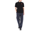 COMME DES GARCONS Polo-T-Shirt mit rotem Herz-Patch Schwarz 157119232 [P]